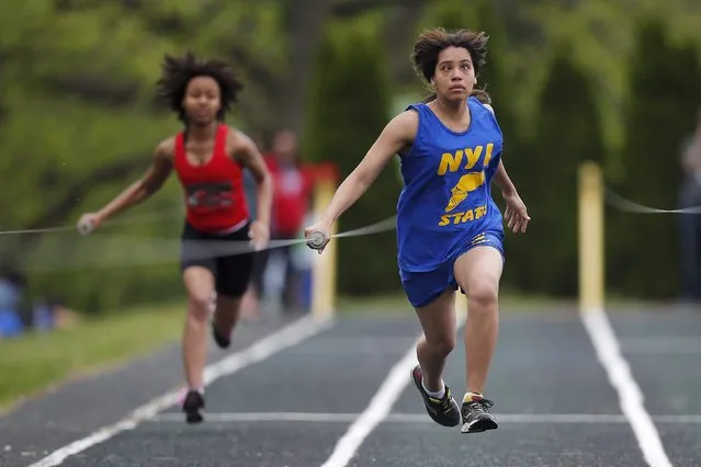 Tyeisha Gillyard (L), from the Overbrook School for the Blind and Esmeralda Chavez, from the New York Institute for Special Education, compete in the girls 75-yard dash during the annual Eastern Athletic Association for the Blind track and field tournament at the Perkins School for the Blind in Watertown, Massachusetts May 16, 2015. (Photo by Brian Snyder/Reuters)