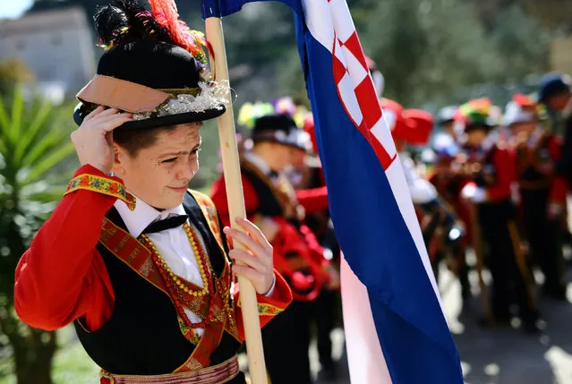 A boy dressed in a traditional costume is pictured before the “Poklad” in Lastovo, Croatia, February 28, 2017. (Photo by Antonio Bronic/Reuters)