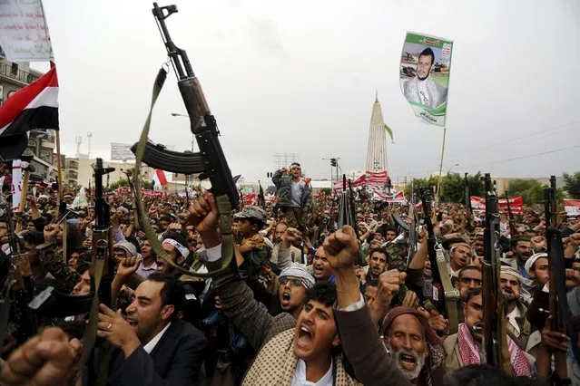 Houthi followers hold up their weapons during a demonstration against the Saudi-led air strikes, in Sanaa May 8, 2015. (Photo by Khaled Abdullah/Reuters)