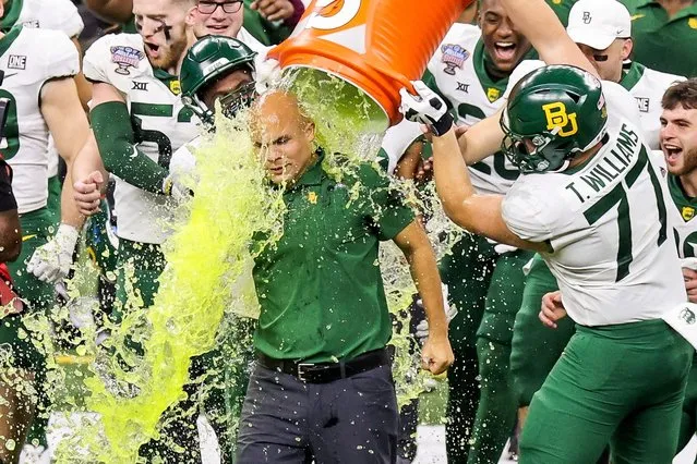 Baylor Bears head coach Dave Aranda is doused with a sports drink by his players in the final seconds of the Bears victory over the Mississippi Rebels in the 2022 Sugar Bowl at the Caesars Superdome in New Orleans, January 1, 2022. (Photo by Stephen Lew/USA TODAY Sports)