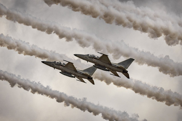 Philippine Air Force pilots maneuver FA-50PH fighter jets as they perform an air show with the Republic of Korea Air Force's (ROKAF) aerobatic unit “Black Eagles” on March 03, 2024 in Pampanga, Philippines. The Republic of Korea Air Force's (ROKAF) aerobatic unit “Black Eagles” is in the Philippines to conduct a series of air shows to mark the 75th anniversary of diplomatic relations between the Philippines and South Korea. (Photo by Ezra Acayan/Getty Images)