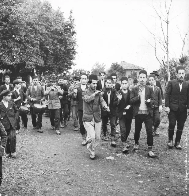 1955:  Musicians herald the coming of bridal guests during a wedding ceremony in the Mananderen province near the Caspian Sea