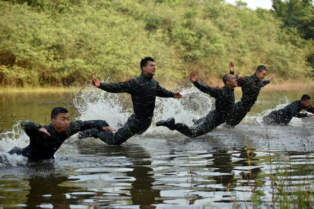 Paramilitary policemen participate in a training session in Nanning, Guangxi Zhuang Autonomous Region, China May 3, 2017. (Photo by Reuters/Stringer)