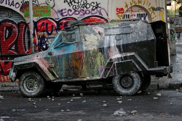 A vandalised riot police vehicle is seen during a protest against Chile's government in Santiago, Chile on October 30, 2019. (Photo by Henry Romero/Reuters)