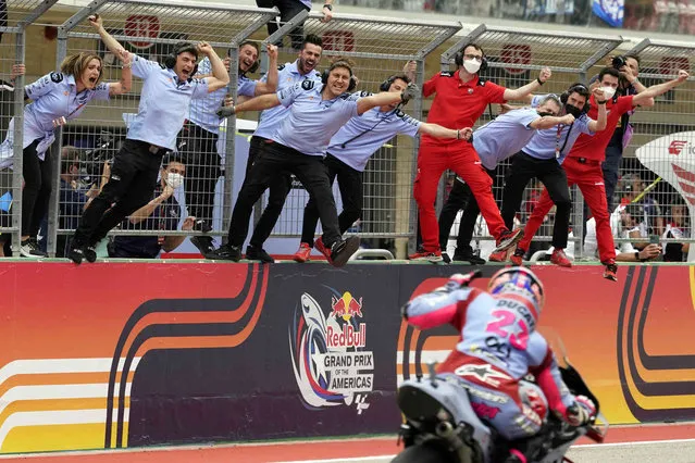 Enea Bastianini (23), of Italy, celebrates with his team as he wins the MotoGP Grand Prix of the Americas motorcycle race at the Circuit of the Americas, Sunday, April 10, 2022, in Austin, Texas. (Photo by Eric Gay/AP Photo)
