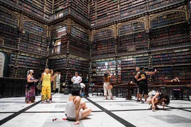 People visit the Royal Portuguese Cabinet of Reading in Rio de Janeiro, Brazil, April 19, 2022. (Photo by Xinhua News Agency/Rex Features/Shutterstock)
