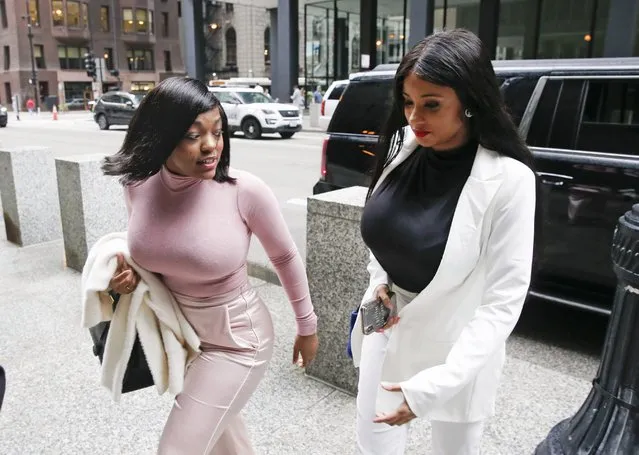 Supporters of singer R. Kelly, Joycelyn Savage and Azriel Clary arrive for the singer's arraignment at the Dirksen Federal Building on July 16, 2019 in Chicago, Illinois. (Photo by Nuccio DiNuzzo/Getty Images)