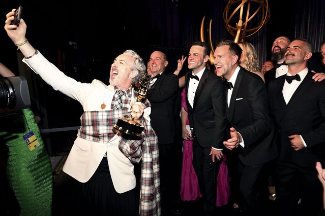 Actor Alan Cumming with crew of “The Traitors” backstage at the 76th Emmy Awards on Sunday, September 15, 2024 at the Peacock Theater in Los Angeles. (Photo by Dan Steinberg/Invision for the Television Academy/AP Content Services)