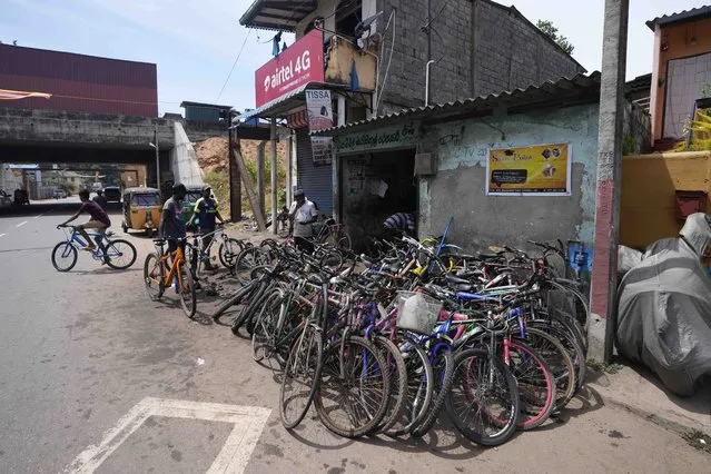 Bicycles given to be repaired are seen outside a workshop amid fuel shortage in Colombo, Sri Lanka, Tuesday, July 5, 2022. (Photo by Eranga Jayawardena/AP Photo)