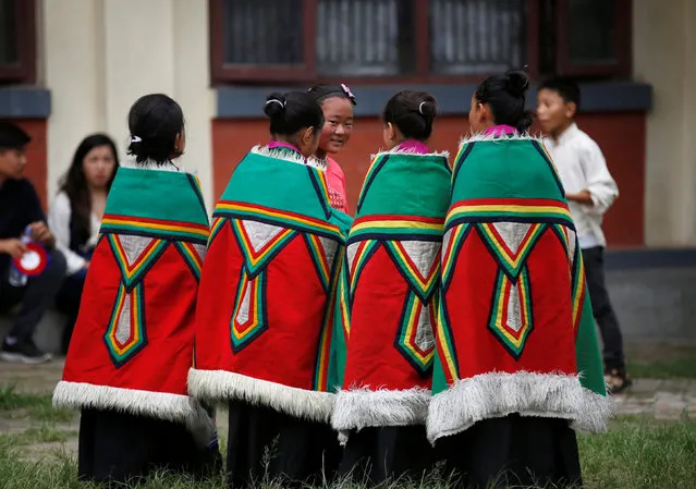 Tibetan girls in a traditional attire take part in a function organized to mark the birthday celebration of Dalai Lama in Kathmandu, Nepal, July 6, 2016. (Photo by Navesh Chitrakar/Reuters)