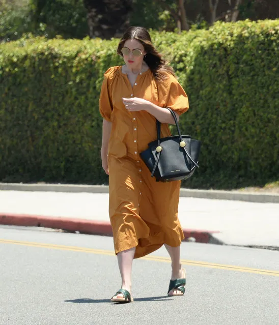 American singer Mandy Moore pampers herself at a salon in Beverly Hills on July 10, 2022. The sighting comes after canceling the remainder of her tour to focus on her pregnancy. Moore showed a hint of her baby bump while wearing an orange dress and black slides. (Photo by The Image Direct)