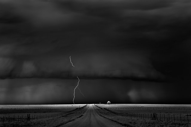 Storm chasing isn't all action. Sometimes, Dobrowner can spend up to a week in his hotel waiting for a storm to reach the right conditions for photographing. Here: “Road”, Guymon, Okla., 2009. (Photo by Roger Hill)