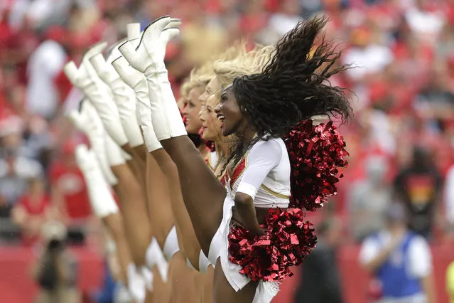 Kansas City Chiefs cheerleaders perform during the first half of an NFL football game against the Dallas Cowboys at Arrowhead Stadium in Kansas City, Mo., Sunday, September 15, 2013. (Photo by Charlie Riedel/AP Photo)