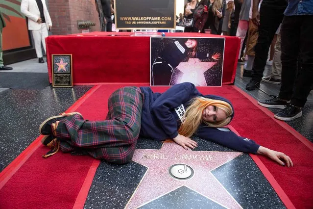Canadian singer-songwriter Avril Lavgine poses for a photo during a ceremony to unveil her Hollywood Walk of Fame Star in Hollywood, California, on August 31, 2022. (Photo by Valerie Macon/AFP Photo)