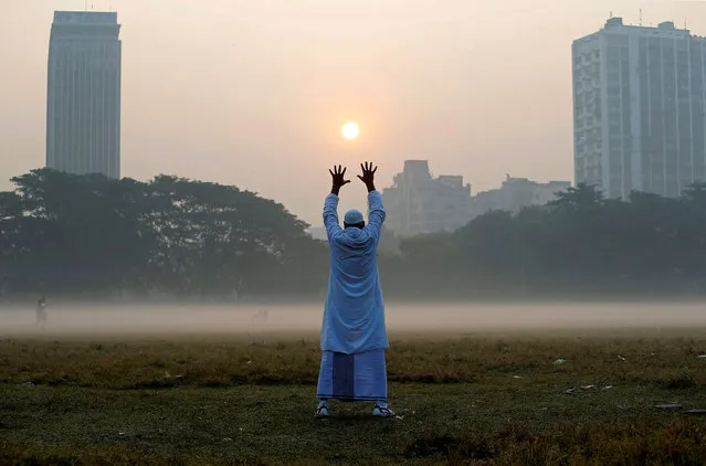 A man exercises in a park on a winter morning in Kolkata, India, December 4, 2017. (Photo by Rupak De Chowdhuri/Reuters)