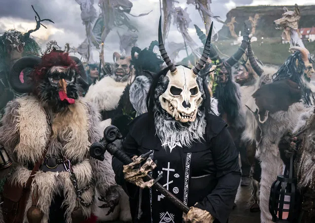 Participants during the Whitby Krampus Run street parade on Saturday, December 3, 2022 in Whitby, Yorkshire, which celebrates the Krampus, a horned creature who accompanies Saint Nicholas on his rounds. (Photo by Danny Lawson/PA Wire)