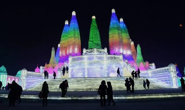 Tourists enjoy spectacular ice and snow sculptures at the Harbin Ice and Snow World Park in Harbin, China on January 2, 2018. (Photo by Sipa Asia/Rex Features/Shutterstock)