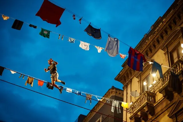 Moritz Purer of Austria at the Red Bull Airlines and "The Walk" movie freestyle slackline competition above the balconies in Catania, Sicily. (Photo by Guido De Bortoli/Getty Images for Sony Pictures Entertainment)