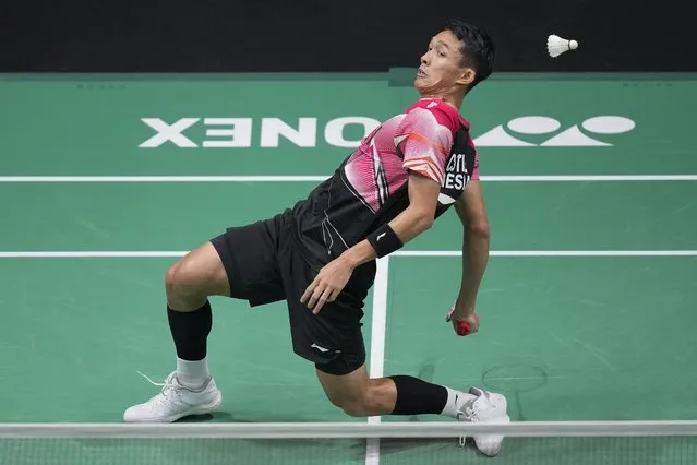 Indonesia's Jonatan Christie plays a shot against Japan's Kenta Nishimoto during their men's singles match at the Malaysia Open badminton tournament at Bukit Jalil Axiata Arena in Kuala Lumpur, Malaysia, Thursday, January 12, 2023. (Photo by Vincent Thian/AP Photo)