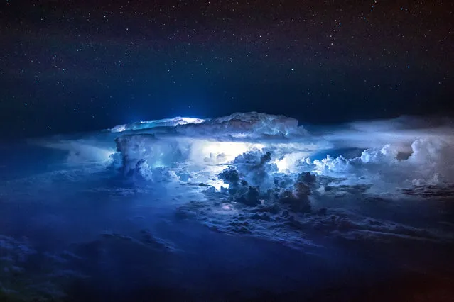 Thunderstorms light up the insides of clouds. (Photo by Christiaan van Heijst/Daan Krans/Caters News Agency)