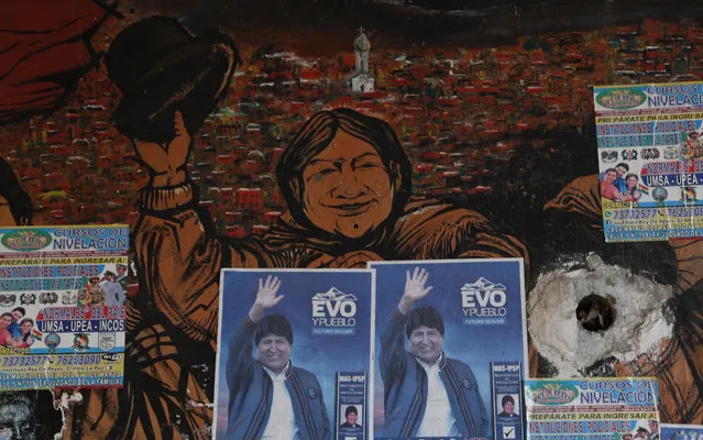 Posters of former Bolivian President Evo Morales adorn a wall in El Alto, Bolivia, Thursday, October 15, 2020. Bolivia will hold general elections on Sunday, although Morales is not a candidate. (Photo by Juan Karita/AP Photo)