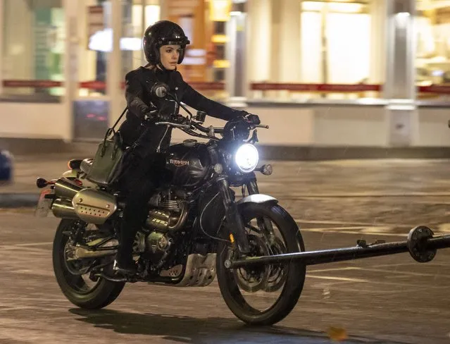 Anne Hathaway and Chiwetel Ejiofor pictured filming pandemic-themed film Lockdown outside iconic department store Harrods in London on October 20, 2020. The Oscar-winning actress, 37, was seen riding a Triumph motorcycle in the early hours of the morning as she escapes London in the comedy-drama helmed by director and creator Doug Liman. 20 Oct 2020 Pictured: Anne Hathaway, Chiwetel Ejiofor. (Photo by Click News and Media/The Mega Agency)