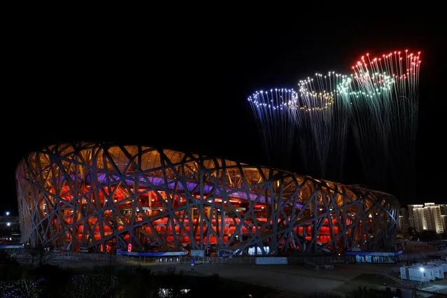 A general view of fireworks light up the sky above the National Stadium, known as the Bird's Nest, during the closing ceremony of the Beijing 2022 Winter Olympic Games in Beijing, on February 20, 2022. (Photo by Tyrone Siu/Reuters)