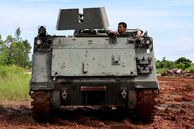 A soldier is seen on an Armored Personnel Carrier (APC) on a road near Thailand-Cambodia's border in Sisaket province, the day after the leaders of Cambodia and Thailand agreed to a ceasefire on Monday in a bid to bring an end to their deadliest conflict in more than a decade and ahead of military negotiations, Thailand, on July 29, 2025. (Photo by Athit Perawongmetha/Reuters)