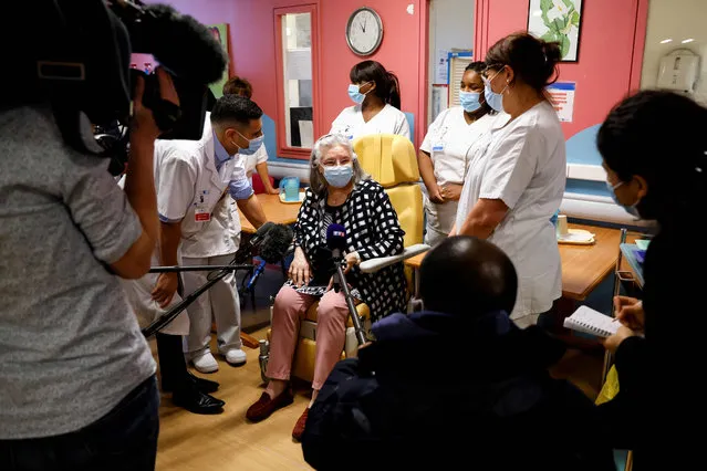 Mauricette, a French 78-year-old woman, talks with medical staff after she received a dose of the Pfizer-BioNTech Covid-19 vaccine at the Rene-Muret hospital in Sevran, on the outskirts of Paris, on December 27, 2020. Mauricette was the first person who received a dose of the Covid-19 vaccine in France against Covid-19, as countries of the European Union began a vaccine rollout. (Photo by Thomas Samson/AFP Photo)