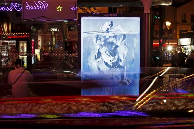 A poster by street artist Hannah Adamaszek as part of the "Brandalism" project is displayed at a bus stop in Paris, France, November 28, 2015, ahead of the United Nations COP21 Climate Change conference in Paris. (Photo by Benoit Tessier/Reuters)