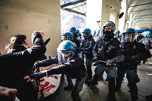 Students clash with Police during the 'No Meloni Day' demonstration in Turin, Italy, 15 November 2024. Protests against the education policies of the government of Italian Prime Minister Giorgia Meloni are being held in several Italian cities. (Photo by Tino Romano/EPA/EFE)