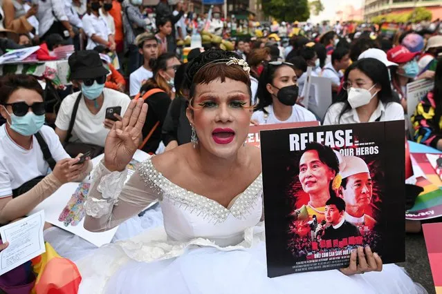 A member of the LGBTQ community shows the three-finger salute during a protest against the military coup in Yangon, Myanmar, February 19, 2021. (Photo by Reuters/Stringer)