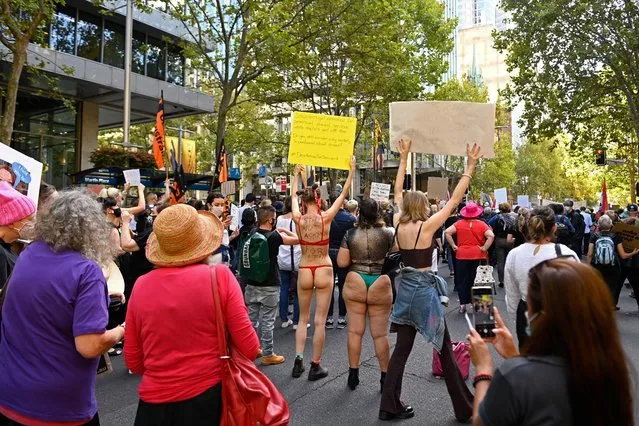 Protesters rally in response to the treatment of women in politics following several sexual assault allegations, as part of the Women's March 4 Justice rally in Sydney, Australia, March 15, 2021. Tens of thousands of women gathered across Australia, calling for gender equality and justice for victims of sexual assault after a recent wave of allegations of sexual abuse, discrimination and misconduct in some of the country's highest political offices. (Photo by Jaimi Joy/Reuters)