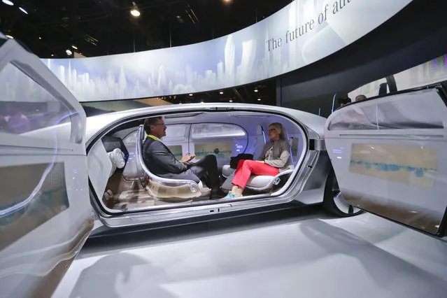 In this January 2015 file photo, attendees sit in the self-driving Mercedes-Benz F 015 concept car at the Mercedes-Benz booth at the International CES, in Las Vegas. Everything we buy or use these days has the potential to be smarter. Self-driving cars can transform our commuting hours into productive time. Sensor-laden socks can let us know how to jog with fewer injuries. (Photo by Jae C. Hong/AP Photo)