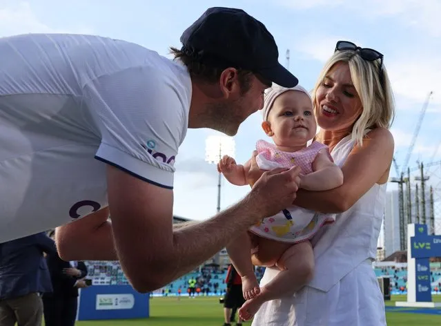 England's Stuart Broad (L), his partner Mollie King and child Annabella, on the field after England's victory on day five of the fifth Ashes cricket Test match between England and Australia at The Oval cricket ground in London on July 31, 2023. England's Stuart Broad took the final two wickets as England beat Australia by 49 runs to win the fifth Test at The Oval on Monday and so end the Ashes series all square at 2-2. (Photo by Adrian Dennis/AFP Photo)