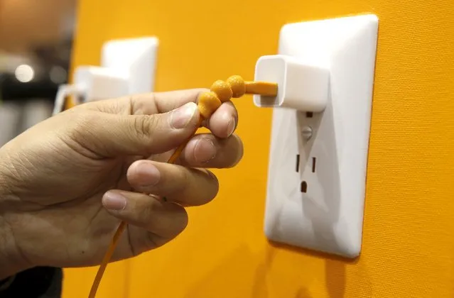 A Snakable USB charging cable is displayed during "CES Unveiled," a preview event of the 2016 International CES trade show, in Las Vegas, Nevada January 4, 2016. The $29.95 cable has a strain relief assembly on both sides of the cable, at the connectors, to keep the cable from failing. (Photo by Steve Marcus/Reuters)