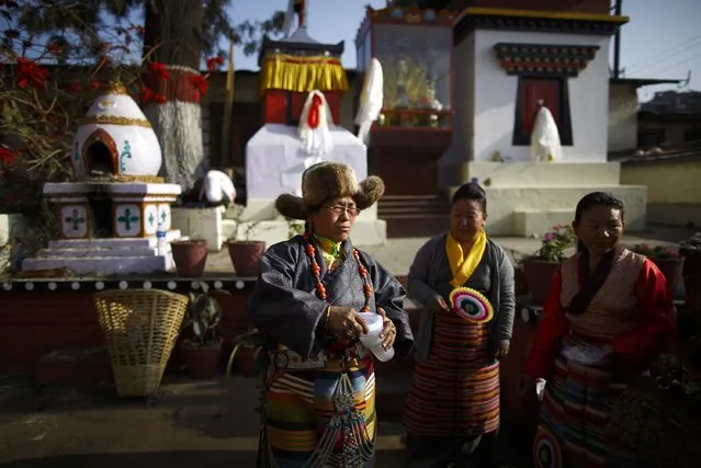 Tibetans dressed in traditional attire take part in a function organised to mark Losar or the Tibetan New Year at Tibetan Refugee Camp in Lalitpur February 19, 2015. (Photo by Navesh Chitrakar/Reuters)