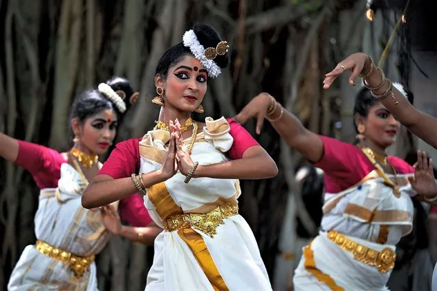 Students perform a traditional dance during the Onam festival celebrations in Chennai on August 25, 2023. (Photo by R. Satish Babu/AFP Photo)