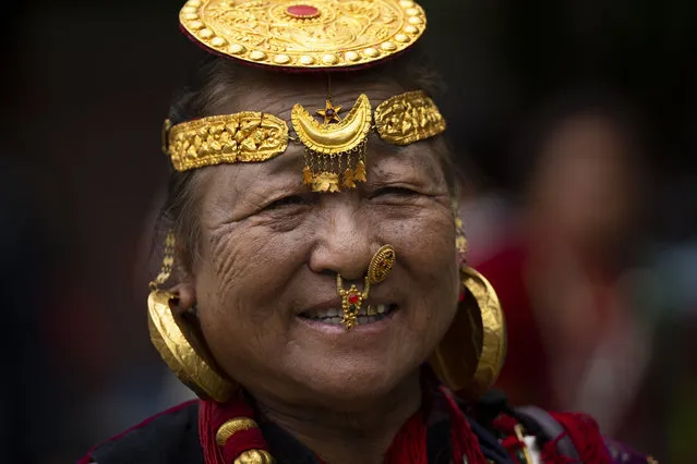 A woman from Nepal's indigenous community wearing traditional ornaments participates in a rally to mark the International Day of the World's Indigenous People in Kathmandu, Nepal, Wednesday, August 9, 2023. (Photo by Niranjan Shrestha/AP Photo)