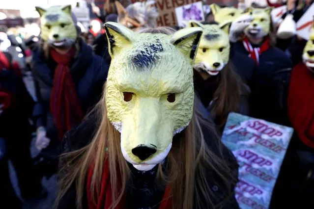 A protester wearing a wolf mask takes part in a demonstration of several wildlife conservation associations against wolf hunting on January 17, 2016, in Nice, southeastern France. (Photo by Valery Hache/AFP Photo)