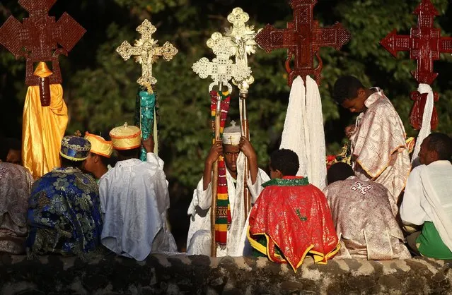 Ethiopian orthodox faithful hold crosses during Ethiopia's Timket celebration to commemorate the baptism of Jesus Christ by John the Baptist in the river Jordan in Gondar, Ethiopia, January 19, 2016. (Photo by Tiksa Negeri/Reuters)