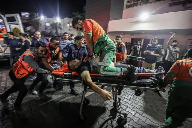 A Palestinian civil defence officer injured in Israeli attacks is given CPR on a stretcher at Al-Shifa Hospital in Gaza Strip, Gaza on October 16, 2023. (Photo by Ali Jadallah/Anadolu via Getty Images)