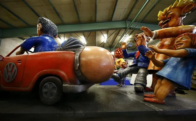 Papier mache caricature figures depicting the Volkswagen diesel emissions scandal for a carnival float, are prepared for the upcoming Rose Monday carnival parade in Mainz, Germany February 2, 2016. (Photo by Kai Pfaffenbach/Reuters)