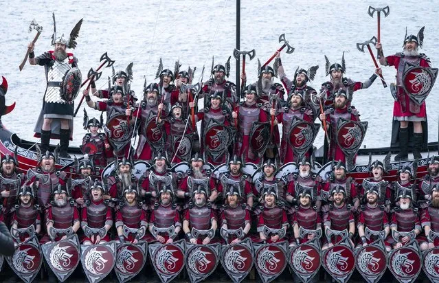 Members of the Jarl Squad and their galley at the harbour in Lerwick on the Shetland Isles during the Up Helly Aa festiva on Tuesday, January 31, 2023l. Originating in the 1880s, the festival celebrates Shetland's Norse heritage. (Photo by Jane Barlow/PA Images via Getty Images)