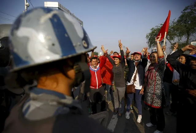 Protesters shout anti government slogans during a nationwide strike, organised by the opposition alliance led by the Unified Communist Party of Nepal (Maoist) to demand the new constitution be drafted with the consensus of all political parties, in Kathmandu April 07, 2015. (Photo by Navesh Chitrakar/Reuters)