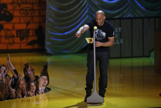 Actor Vin Diesel presents an award at the 2015 MTV Movie Awards in Los Angeles, California April 12, 2015. (Photo by Mario Anzuoni/Reuters)