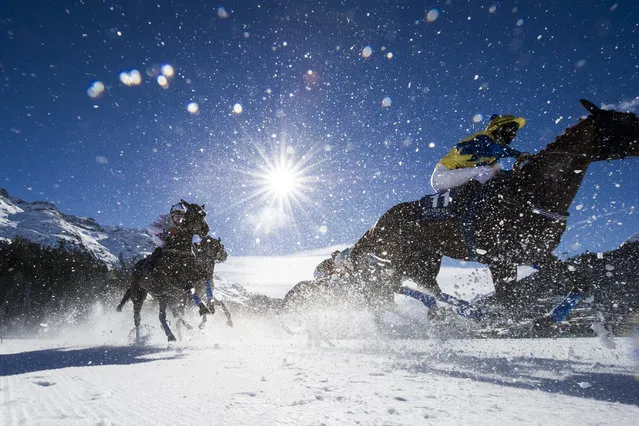 Riders and horses compete in the Gubelin 77th Grand Prix of St. Moritz, with a price money of 111,111 Swiss francs, on the third weekend of the White Turf races in St. Moritz, Switzerland, February 21, 2016. (Photo by Gian Ehrenzeller/EPA)