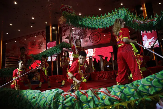 Dancers perform traditional lion and dragon dances at the MGM Grand Hotel and Casino to celebrate the Lunar New Year, Tuesday, February 5, 2019, in Las Vegas. In recent years, the holiday, which people are ringing in Tuesday, has achieved all-American status. Big companies are celebrating – and capitalizing – on a holiday that is about being with loved ones and wishing for prosperity and good luck. (Photo by John Locher/AP Photo)
