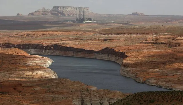 The Navajo Generating Station, a coal-fired powerplant, can be seen near the Colorado River fed Lake Powell outside Page, Arizona, April, 14, 2015. (Photo by Jim Urquhart/Reuters)