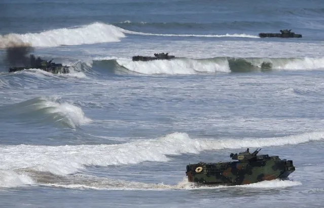 Soldiers from Japan's Ground Self Defense Force come ashore in amphibious assault vehicles as they train alongside U.S. Marines during the bilateral annual Iron Fist military training exercise in Camp Pendleton, California February 26, 2016. (Photo by Mike Blake/Reuters)